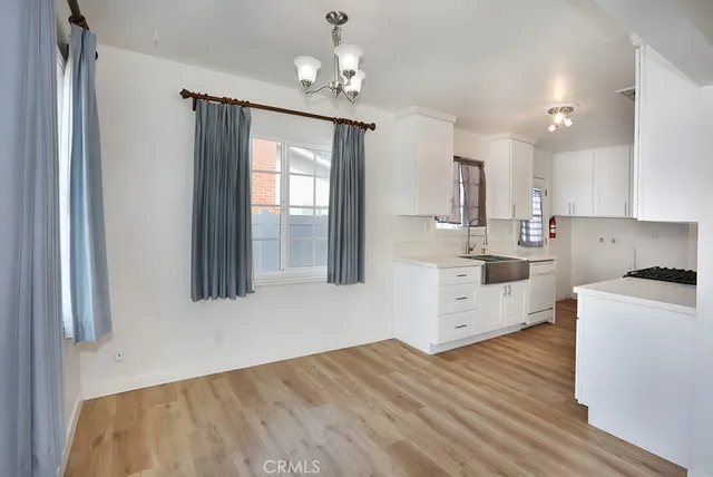 a view of walk in closet with clothes