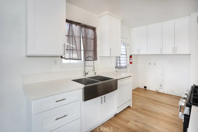a white toilet sitting next to a bathroom sink