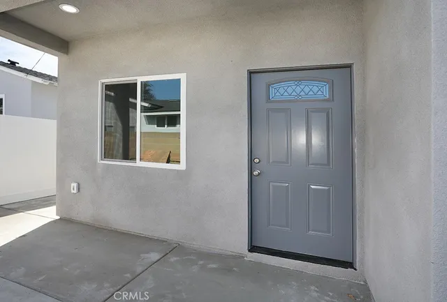 a kitchen with stainless steel appliances sink refrigerator and cabinets