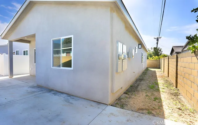 a kitchen with stainless steel appliances granite countertop a stove and white cabinets