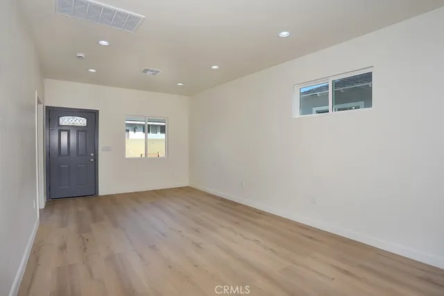 a kitchen with stainless steel appliances granite countertop a sink and a stove