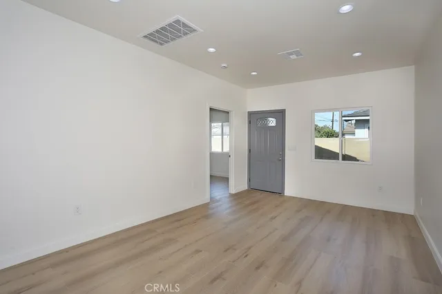 a kitchen with white cabinets and a sink