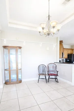 a view of a livingroom with furniture and a chandelier