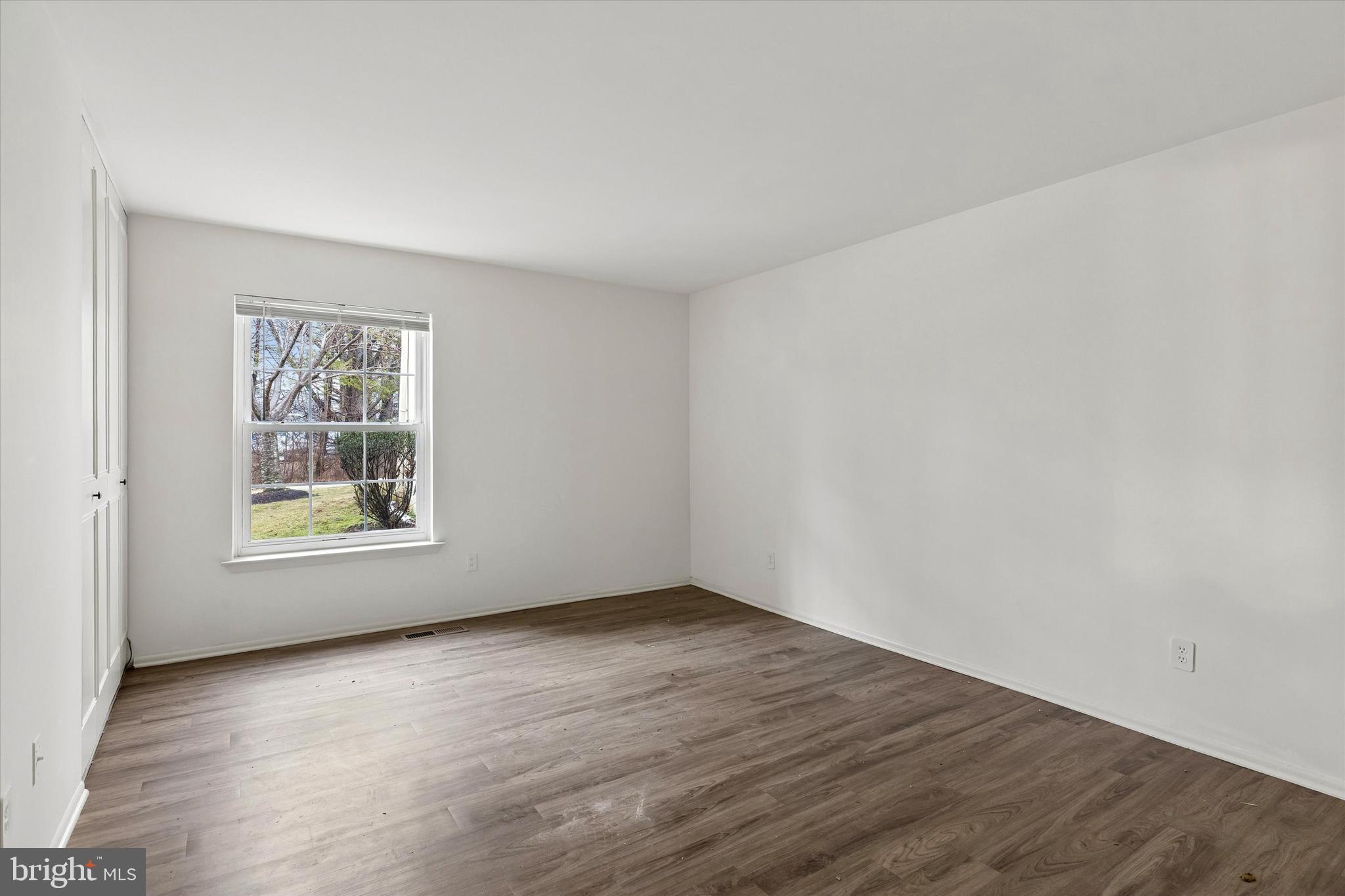 521 Old Forge Crossing Wayne, PA 19087 - Photo 12 of 15 a view of an empty room with wooden floor and a window