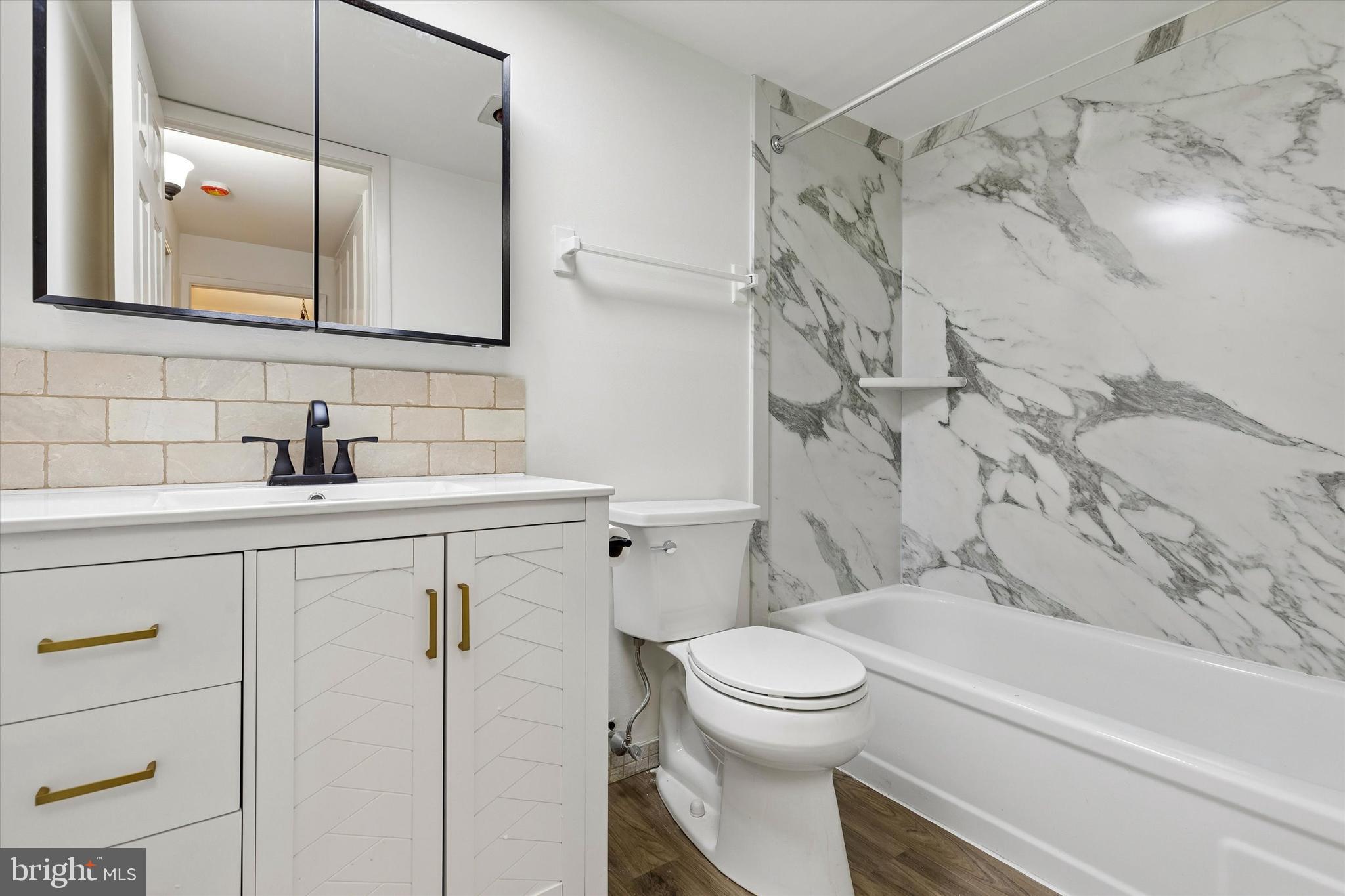 521 Old Forge Crossing Wayne, PA 19087 - Photo 15 of 15 a bathroom with a sink toilet vanity and shower