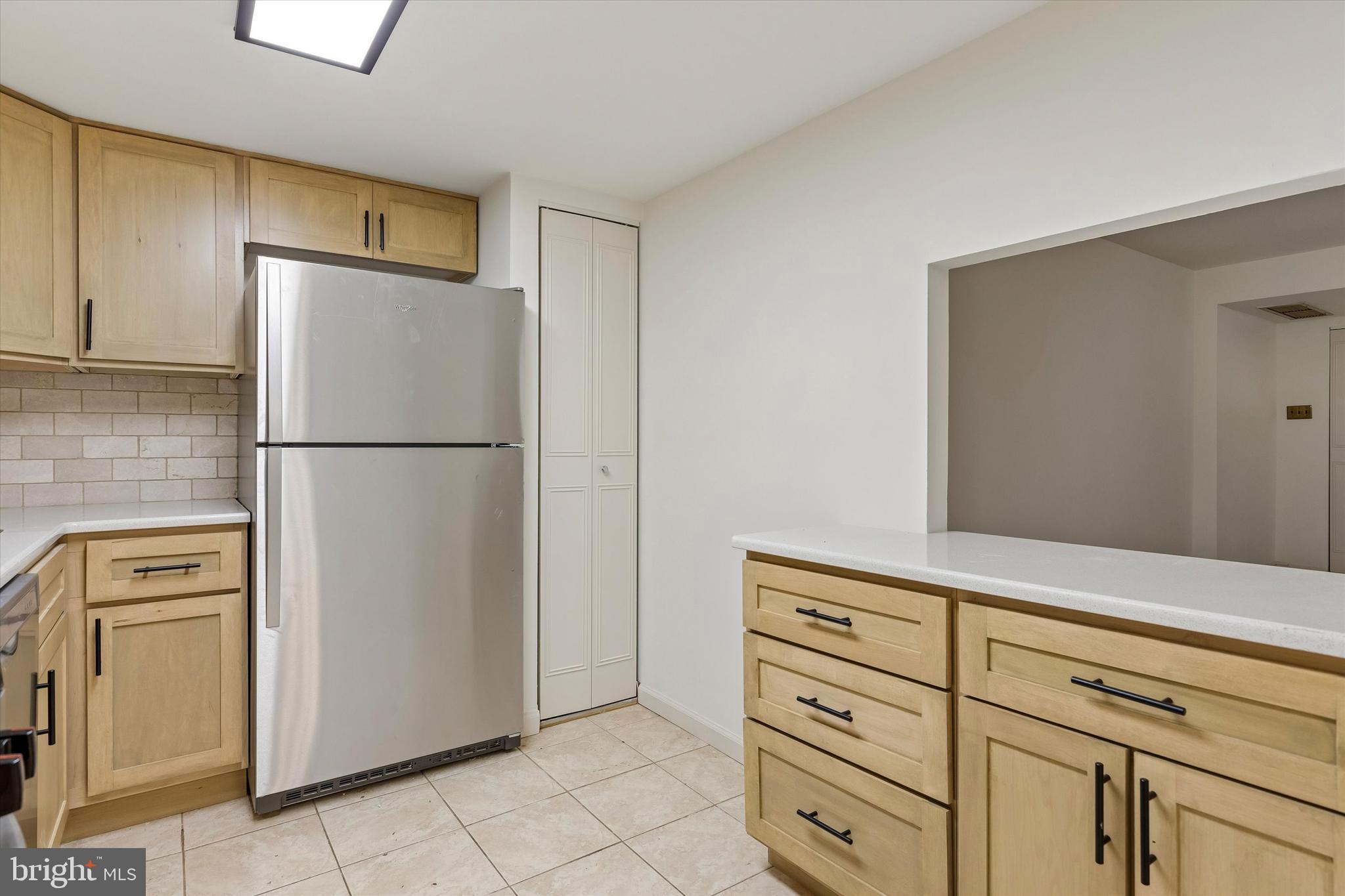 521 Old Forge Crossing Wayne, PA 19087 - Photo 6 of 15 a white refrigerator freezer sitting in a kitchen