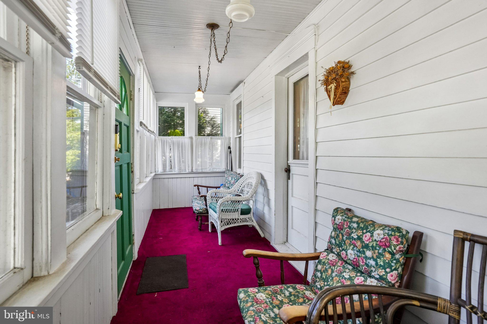 361 Democrat Road Gibbstown, NJ 08027 - Photo 4 of 26 Charming porch with vibrant accents.