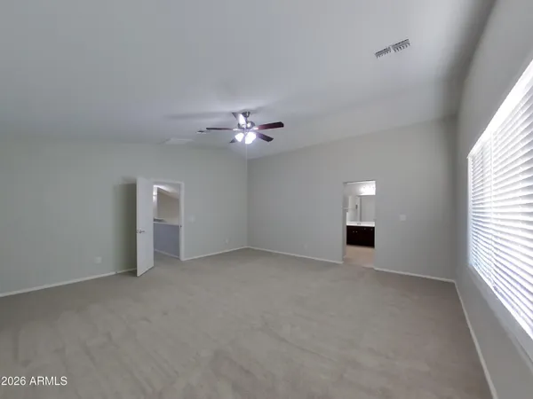 a kitchen with kitchen island a counter top space cabinets and stainless steel appliances