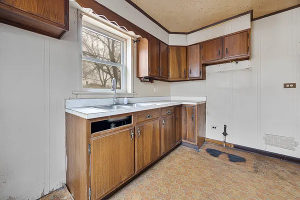 a kitchen with stainless steel appliances granite countertop a sink a stove and a microwave oven