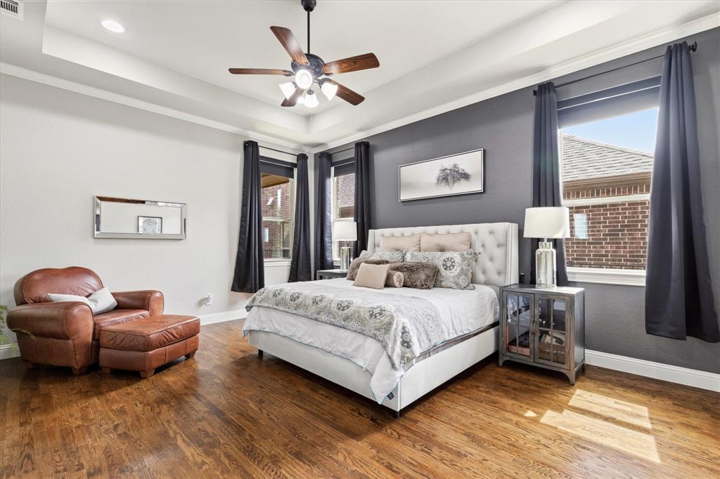 1108 Granada Drive Allen, TX 75013 - Photo 20 of 40 a spacious bedroom with a bed couch and a window