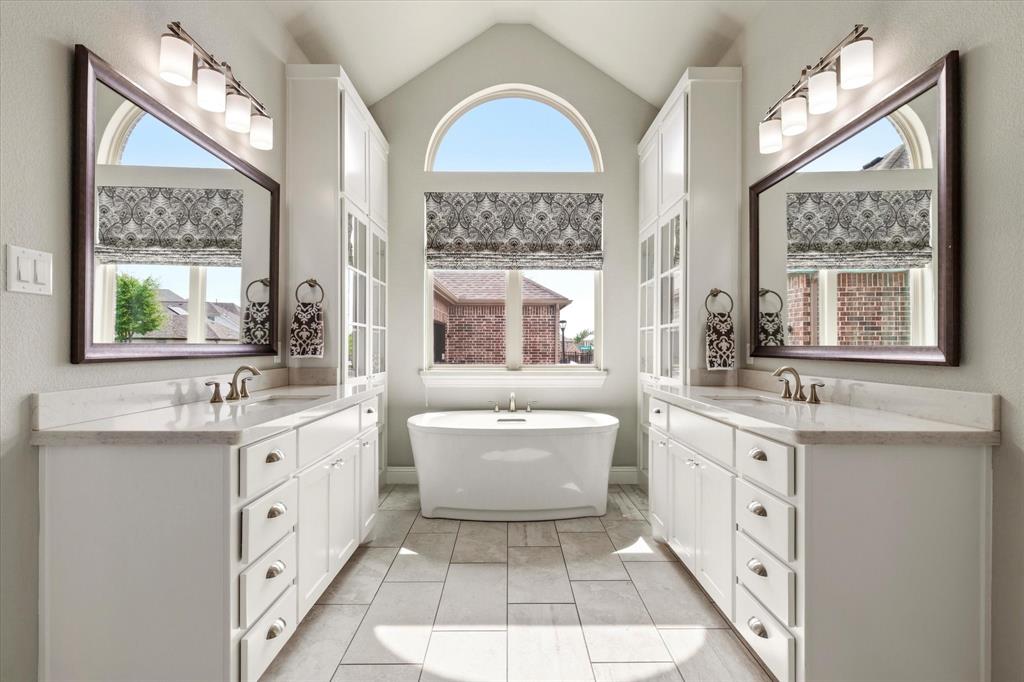 1108 Granada Drive Allen, TX 75013 - Photo 23 of 40 a spacious bathroom with a double vanity sink a mirror and a window