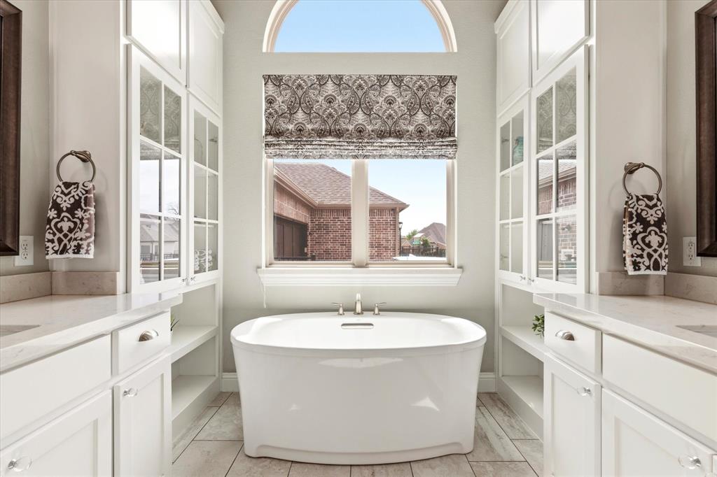 1108 Granada Drive Allen, TX 75013 - Photo 24 of 40 a bathroom with a sink and a window