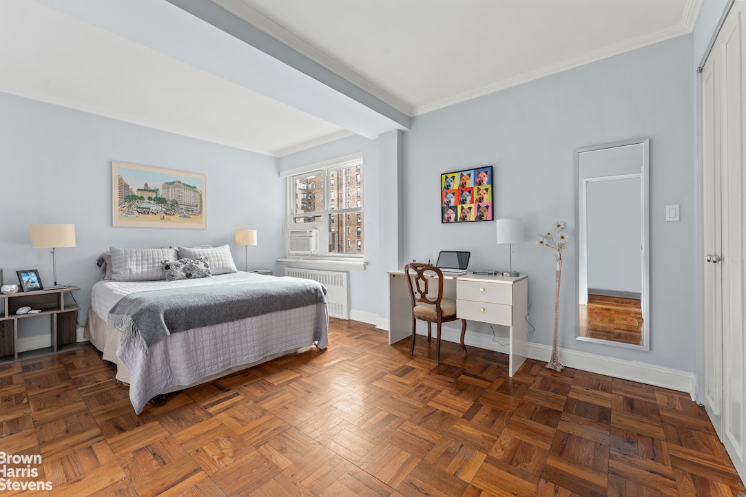 11 Riverside Drive, Unit 11AW Manhattan, NY 10023 - Photo 4 of 13 a spacious bedroom with a bed and a window
