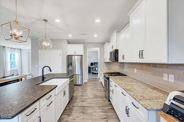 a bathroom with a double vanity sink mirror and shower