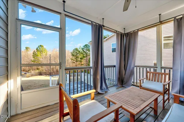 a view of a balcony with wooden floor