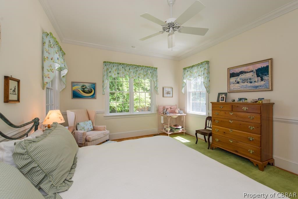 1193 West Point Road Lancaster, VA 22503 - Photo 48 of 50 a bed room with a bed and a painting on the wall