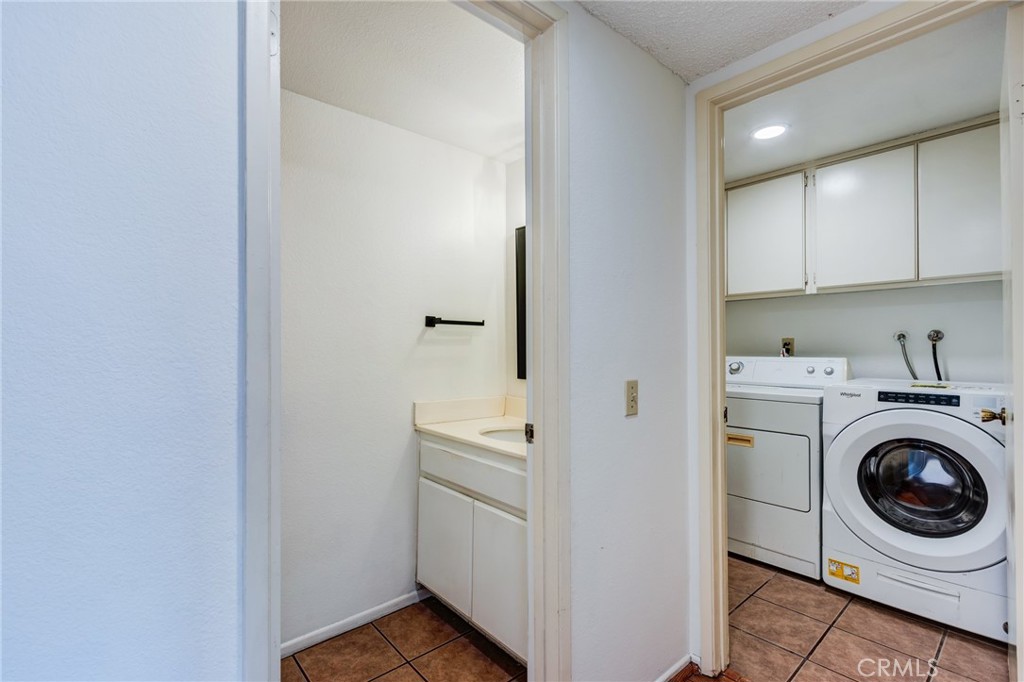 5349 Gooseberry Way Oceanside, CA 92057 - Photo 17 of 35 a utility room with dryer and washer