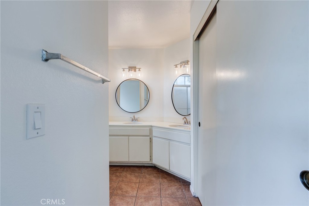 5349 Gooseberry Way Oceanside, CA 92057 - Photo 20 of 35 a bathroom with a sink and a mirror