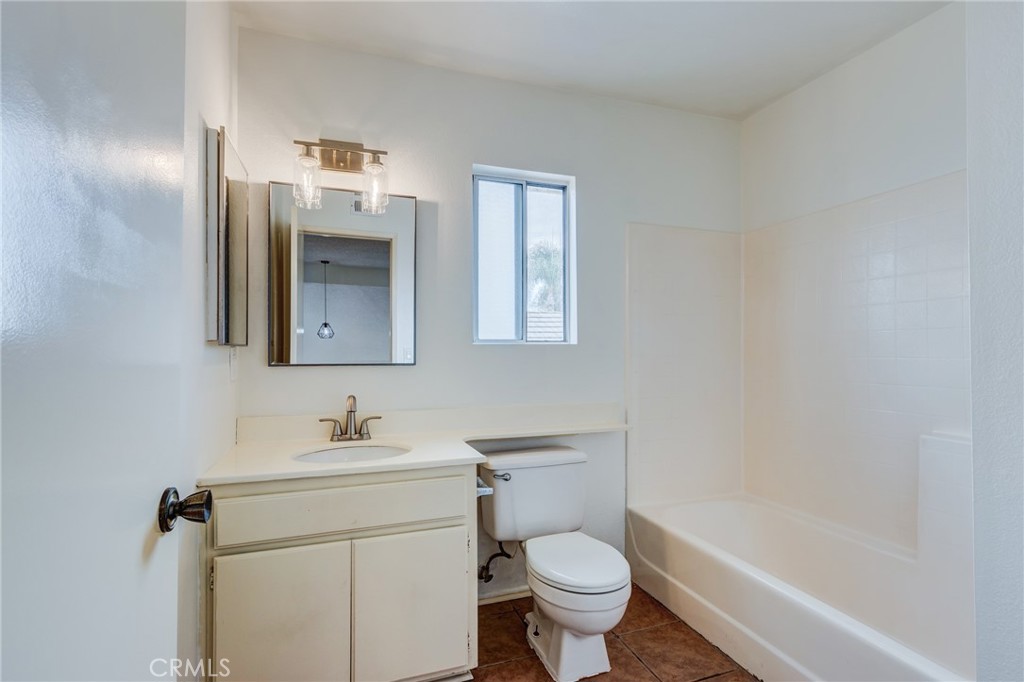 5349 Gooseberry Way Oceanside, CA 92057 - Photo 25 of 35 a bathroom with a sink toilet and shower