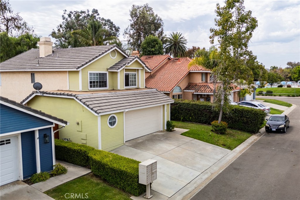 5349 Gooseberry Way Oceanside, CA 92057 - Photo 3 of 35 a front view of a house with a yard and garage