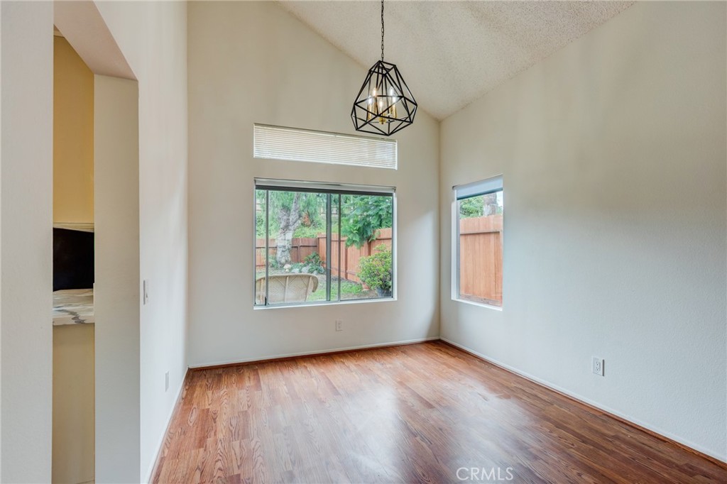 5349 Gooseberry Way Oceanside, CA 92057 - Photo 8 of 35 a view of an empty room with wooden floor and a window