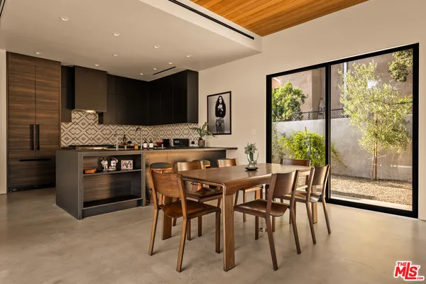 a view of a livingroom with furniture and wooden floor