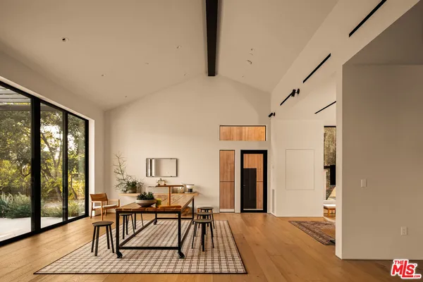 a view of swimming pool with outdoor seating and a garden