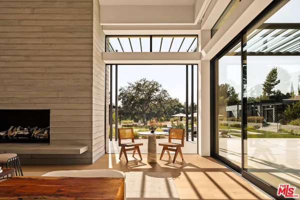 a view of a living room and a balcony