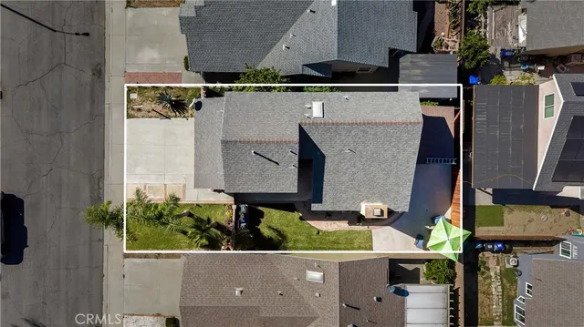 an aerial view of houses with outdoor space