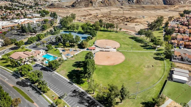 a view of a swimming pool with a yard