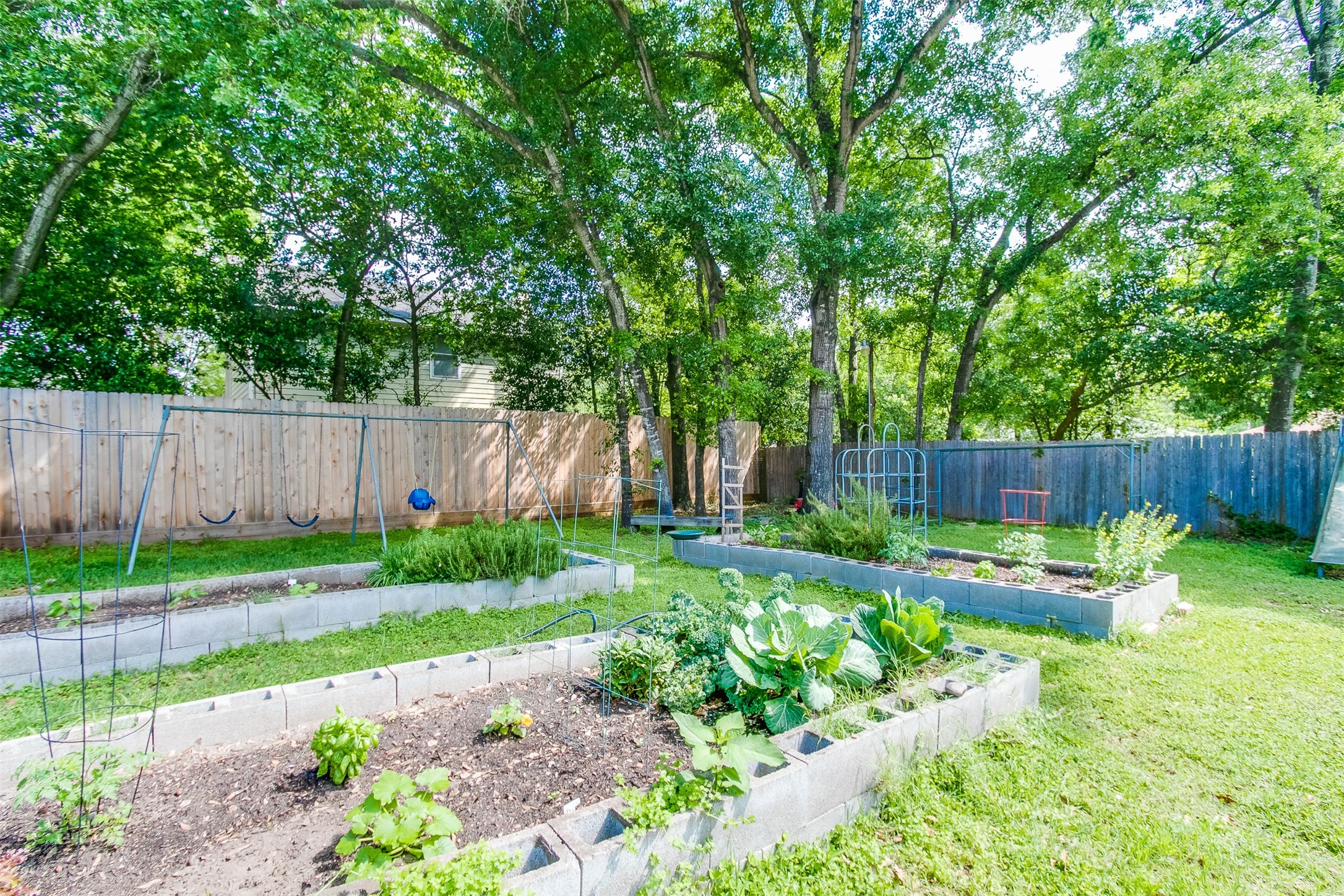 1407 Springrock Lane Houston, TX 77055 - Photo 20 of 25 This peaceful setting features swings, play equipment and community garden to grow your summer favorites. There's nothing like home grown veggies!