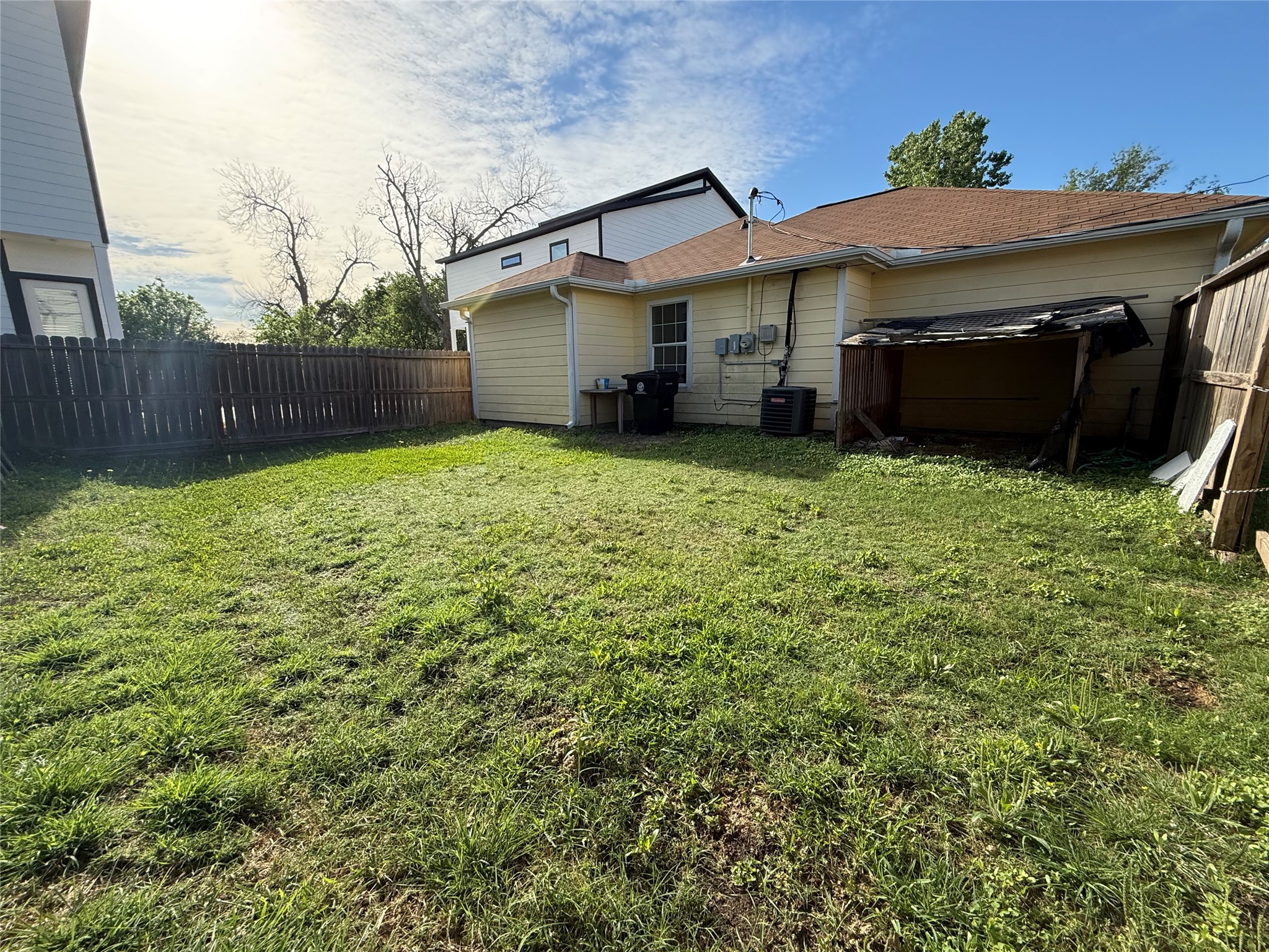 9307 Coffee Street Houston, TX 77033 - Photo 15 of 16 a backyard of a house with lots of green space