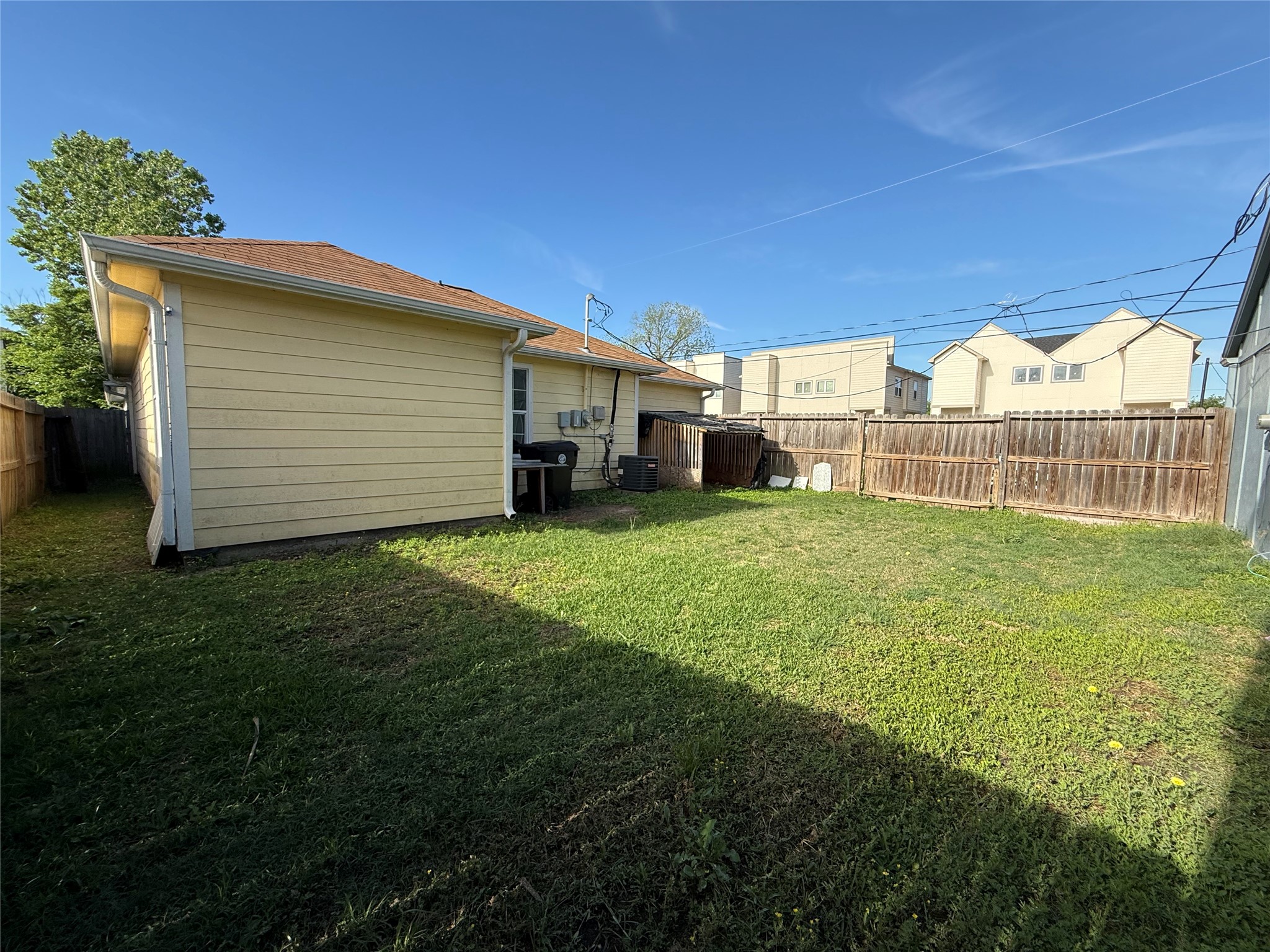 9307 Coffee Street Houston, TX 77033 - Photo 16 of 16 a view of a house with a yard and sitting area