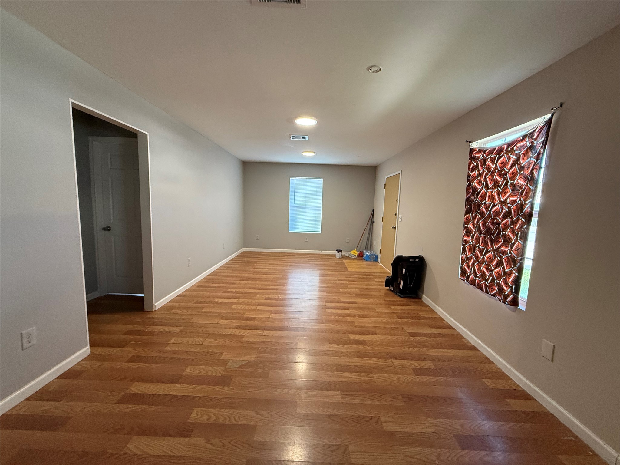 9307 Coffee Street Houston, TX 77033 - Photo 4 of 16 a view of an empty room and window