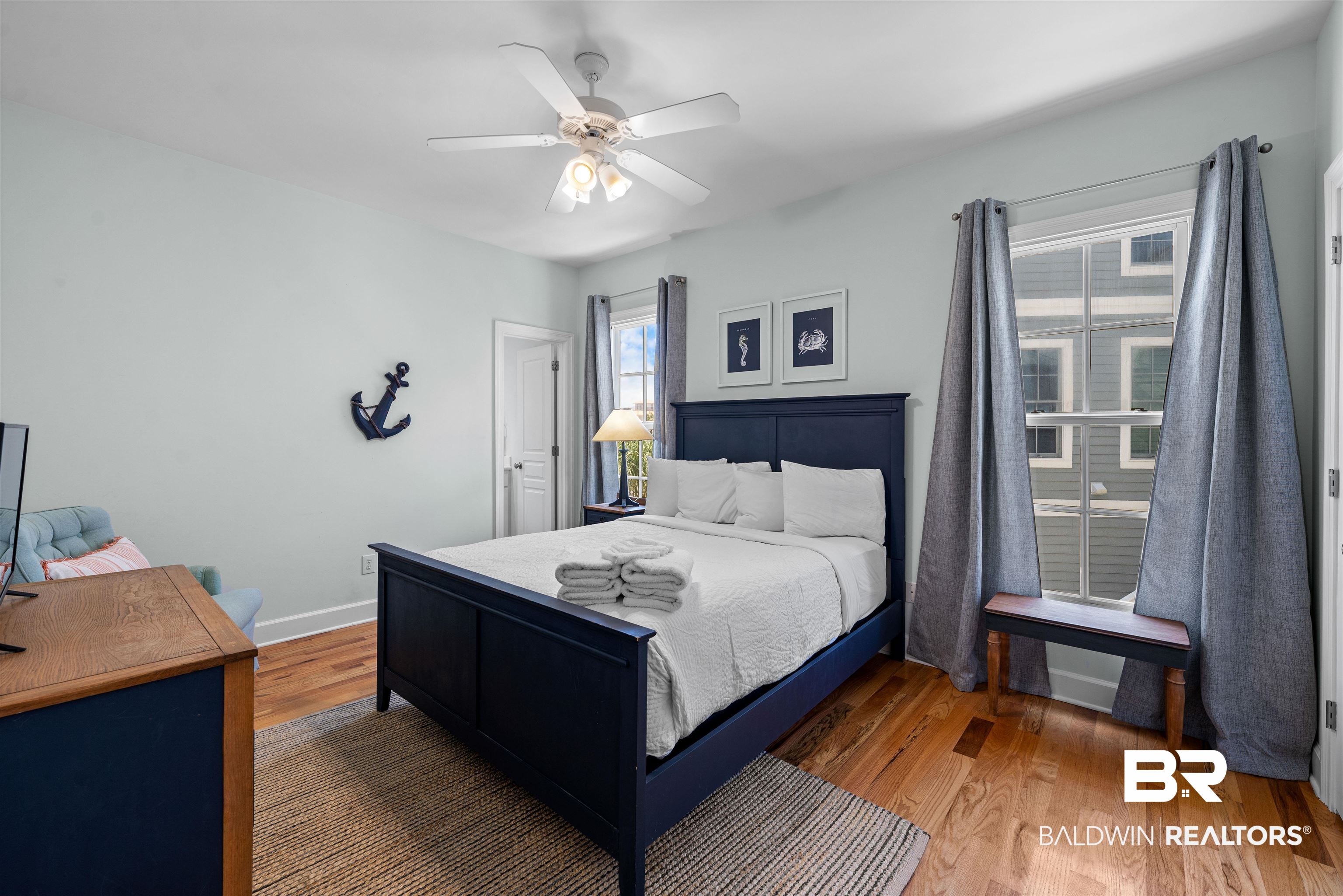 3434 Mariner Circle Orange Beach, AL 36561 - Photo 28 of 38 Bedroom featuring ceiling fan and hardwood / wood-style floors