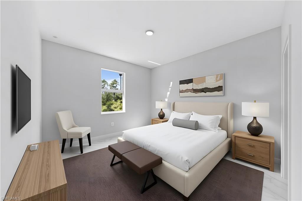 237 Columbus Boulevard South Lehigh Acres, FL 33974 - Photo 12 of 25 a bedroom with a bed and wooden floor