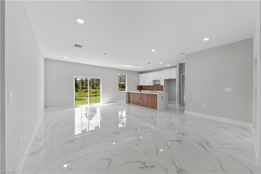 237 Columbus Boulevard South Lehigh Acres, FL 33974 - Photo 9 of 25 a view of kitchen and window