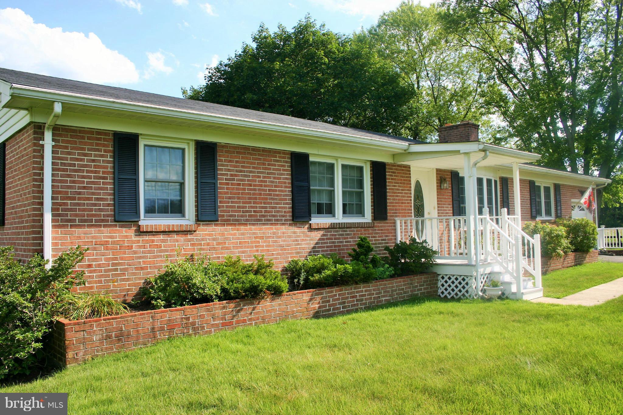 3900 Summit Point Road Charles Town, WV 25414 - Photo 2 of 14 Brick Flower Beds