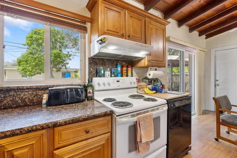 a kitchen that has a stove and a microwave