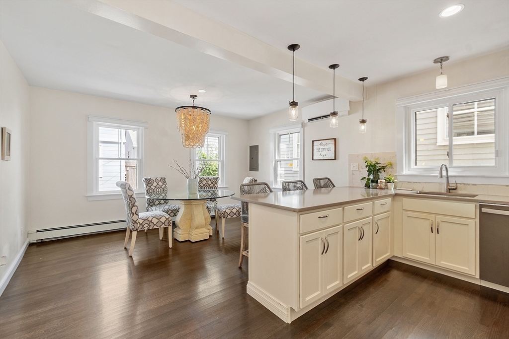 32 Maple Avenue Nahant, MA 01908 - Photo 16 of 37 a large white kitchen with lots of counter space and dining table
