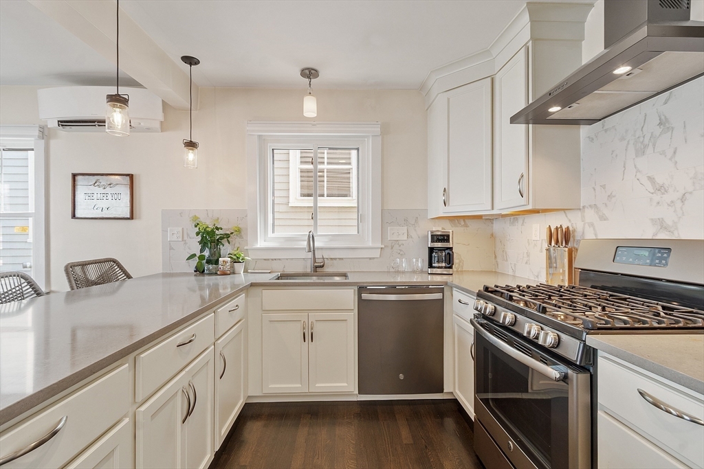 32 Maple Avenue Nahant, MA 01908 - Photo 17 of 37 a kitchen with a sink stove and cabinets