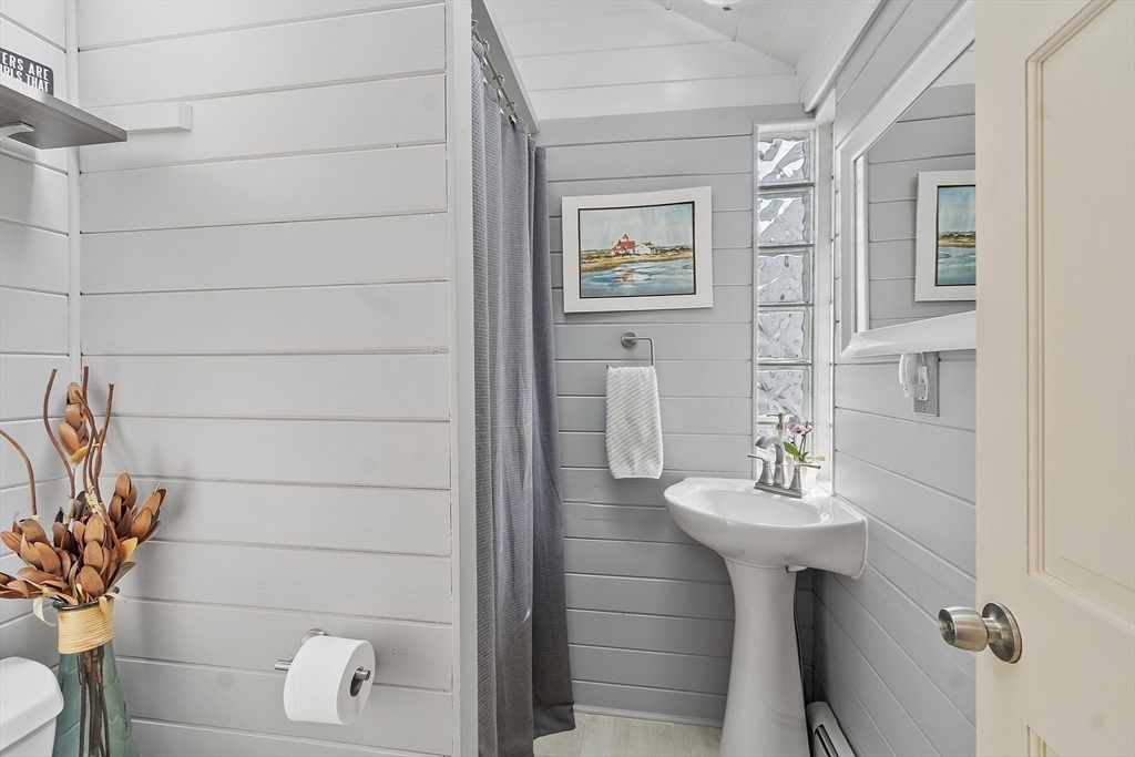 32 Maple Avenue Nahant, MA 01908 - Photo 20 of 37 a bathroom with a sink toilet and mirror