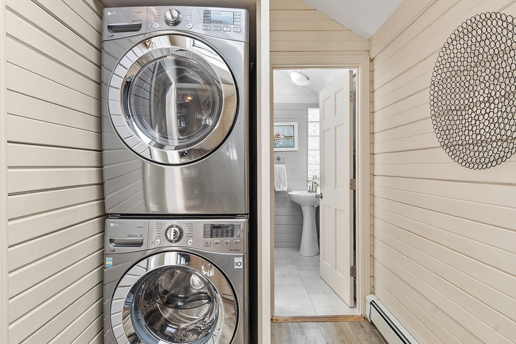 32 Maple Avenue Nahant, MA 01908 - Photo 21 of 37 a view of a bedroom with washer and dryer