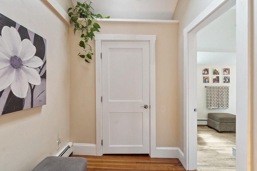 32 Maple Avenue Nahant, MA 01908 - Photo 29 of 37 a view of a bedroom that has a bed and a plant in it