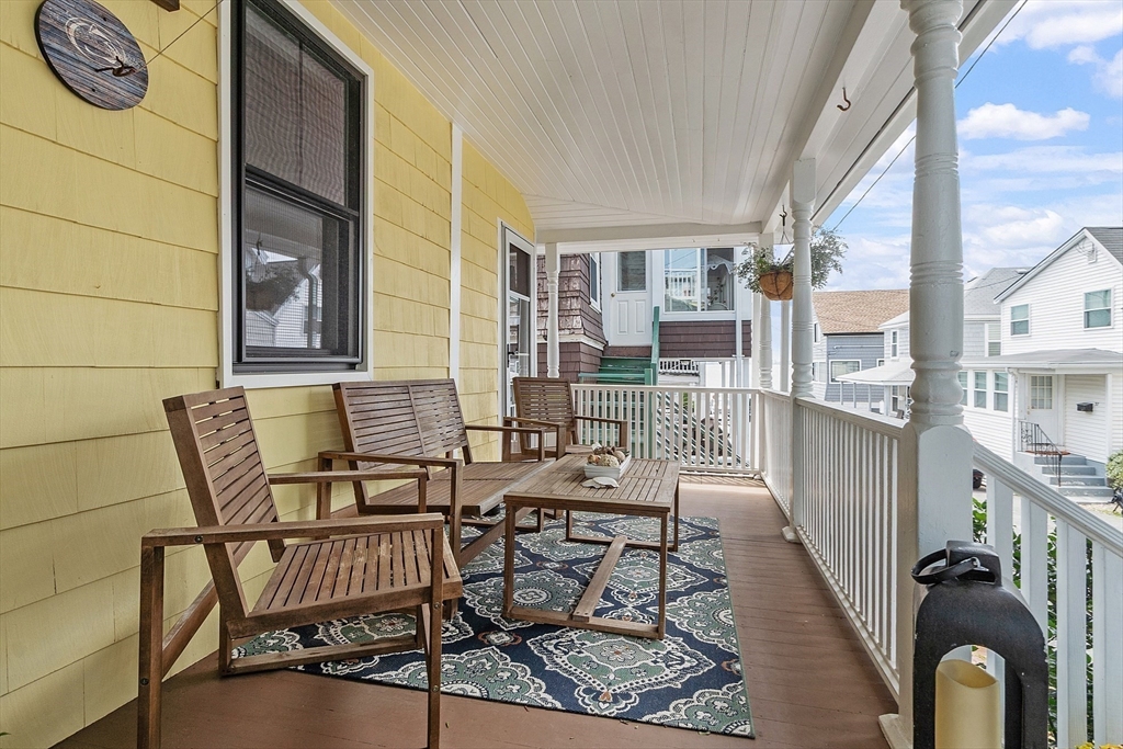 32 Maple Avenue Nahant, MA 01908 - Photo 32 of 37 a view of a balcony with chairs and wooden floor