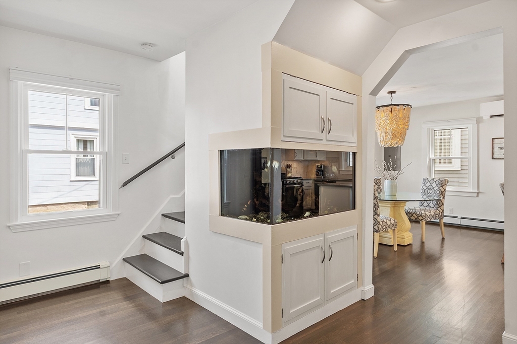 32 Maple Avenue Nahant, MA 01908 - Photo 10 of 37 a view of a livingroom with furniture wooden floor and windows