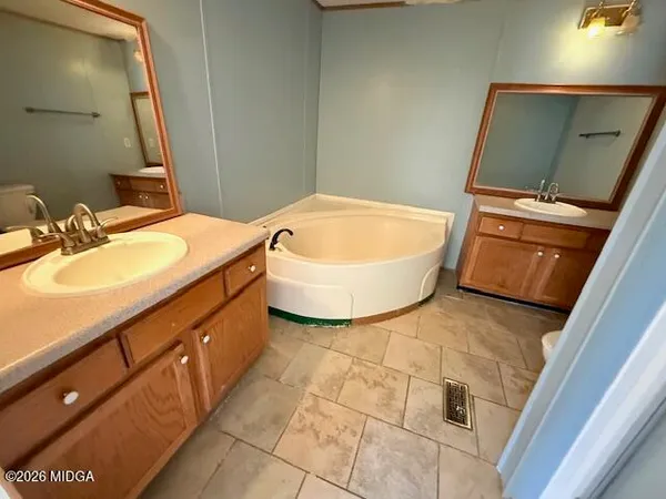 a bathroom with a sink and mirror