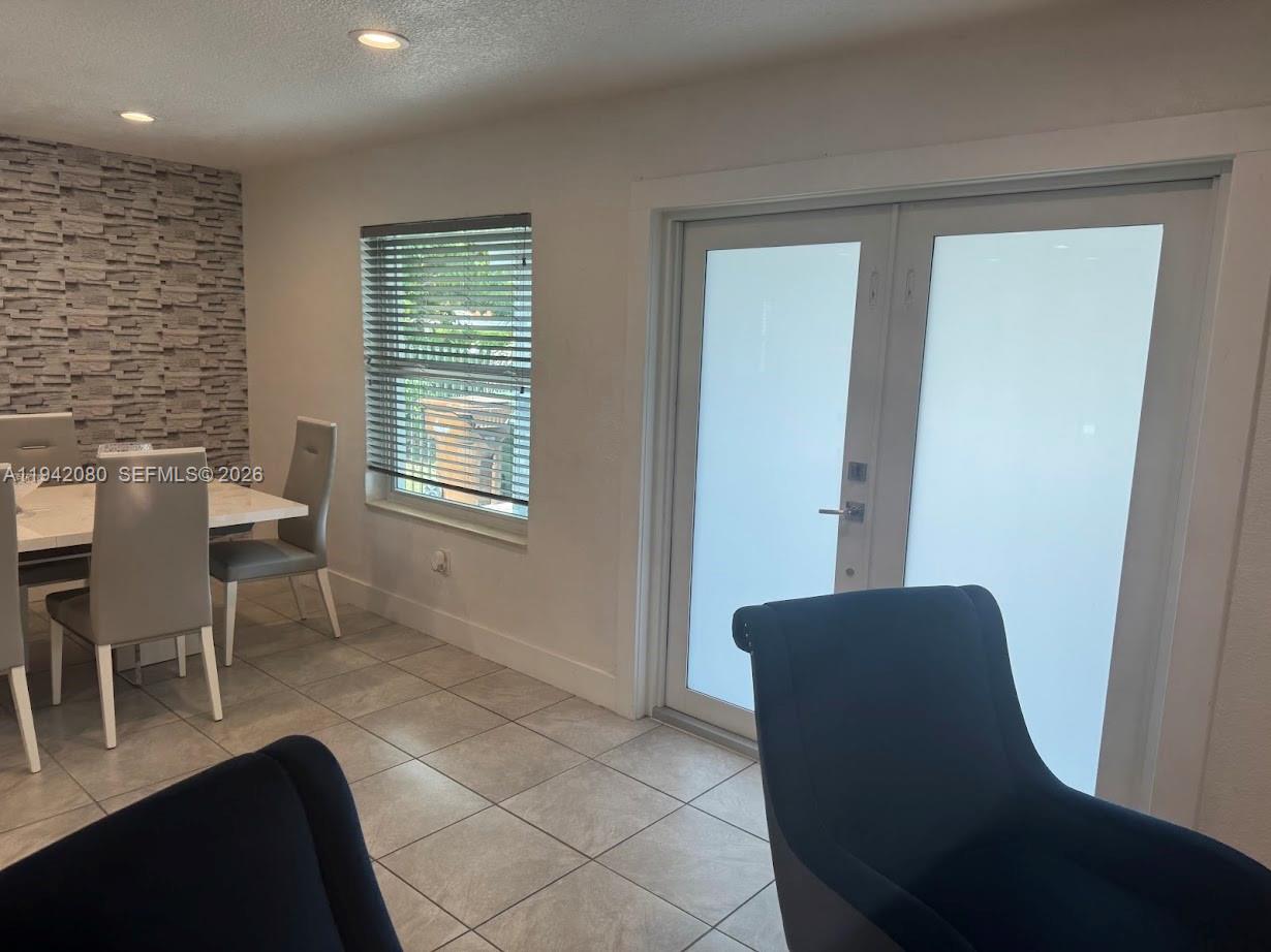 412 West 15th Street Hialeah, FL 33010 - Photo 11 of 48 a living room with furniture and a window