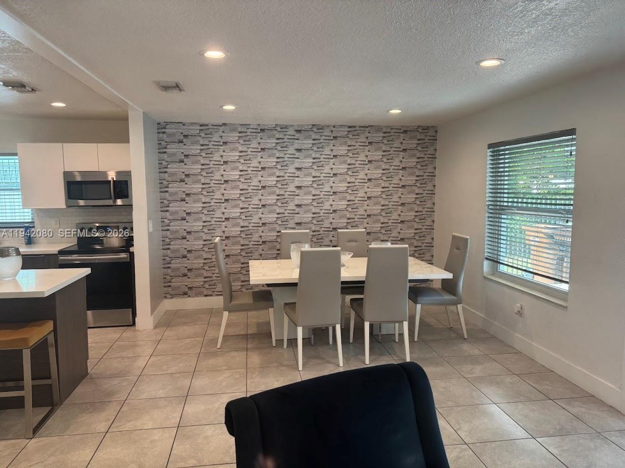 412 West 15th Street Hialeah, FL 33010 - Photo 12 of 48 a view of a dining room with furniture