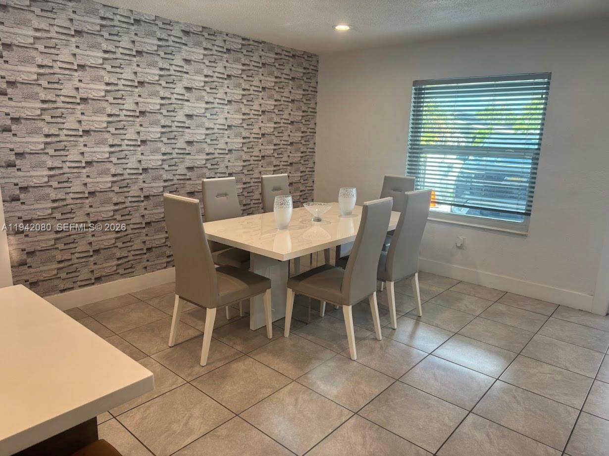 412 West 15th Street Hialeah, FL 33010 - Photo 13 of 49 a view of a dining room with furniture